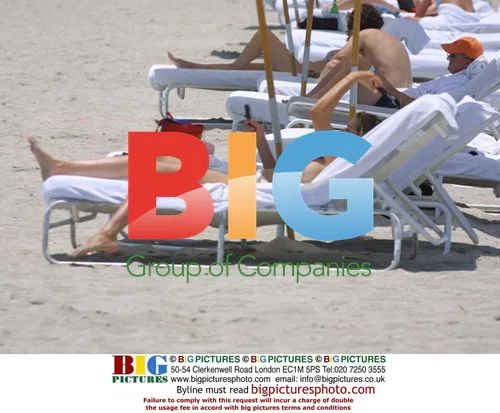 Dean Cain, Samantha Torres, and Son Relax on Miami Beach
