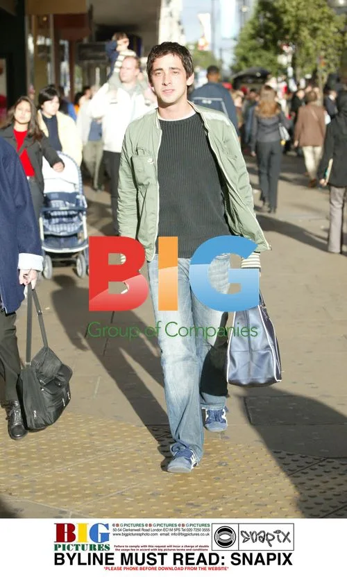 TV presenter COLIN MURRAY hails taxi