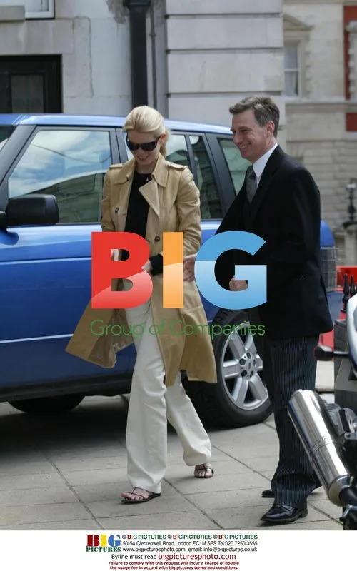 Claudia Schiffer Visits Bank with Husband