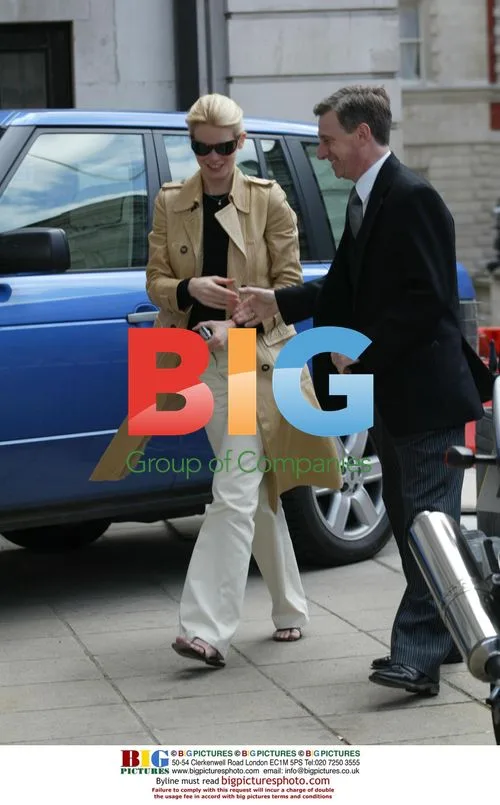 Claudia Schiffer visits bank with husband