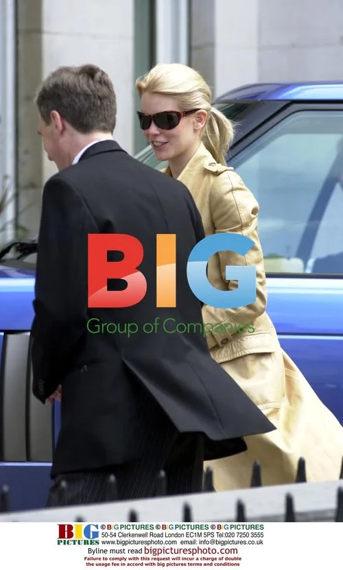 Claudia Schiffer Visits Bank with Husband
