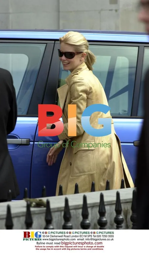 Claudia Schiffer Visits Bank with Husband