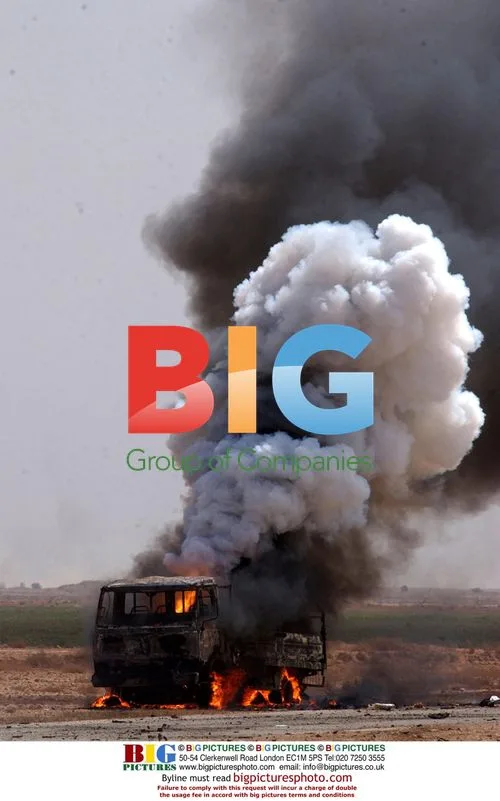 Iraqi vehicle burns after Apache attack