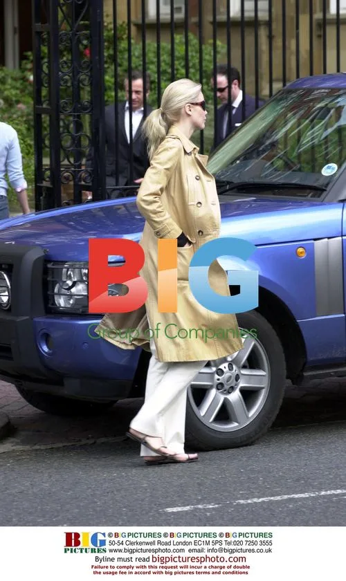 Claudia Schiffer Leaves Home to Visit Bank