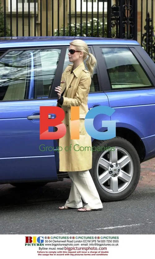 Claudia Schiffer Visits Bank with Husband
