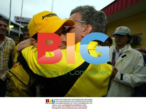Giancarlo Fisichella hugged by Jordan
