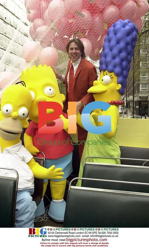 Jonathan Ross with Simpsons on London bus