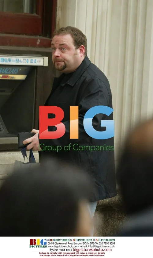 TV Actor John Thompson at cash machine in London