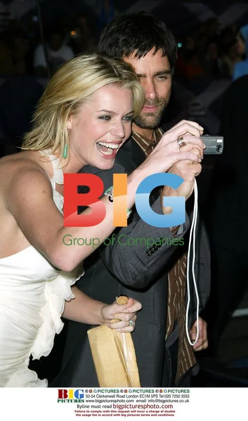 Rebecca Romijn-Stamos and John Stamos at X2 Premiere