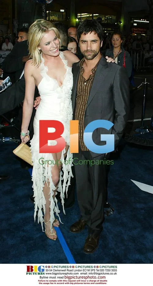 Rebecca Romijn-Stamos and John Stamos at X2 Premiere