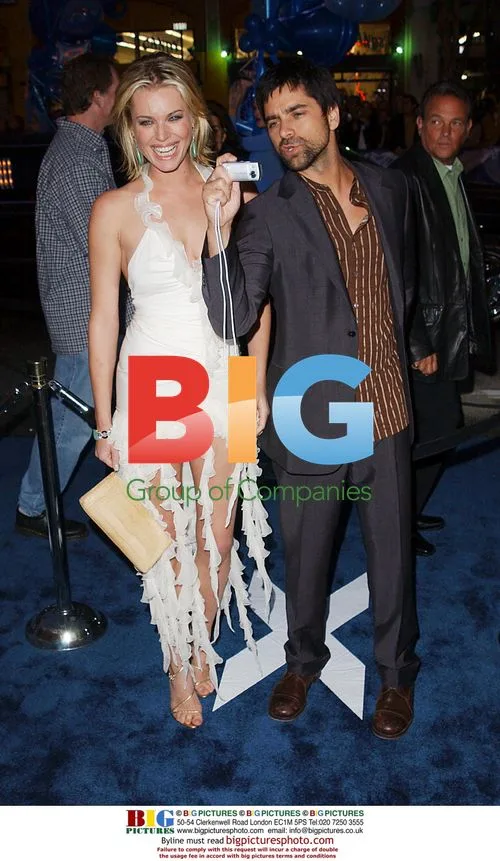 Rebecca Romijn-Stamos and John Stamos at X2 Premiere