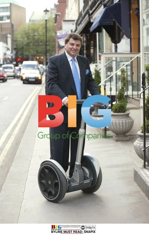 Man Demonstrates Riding Segway