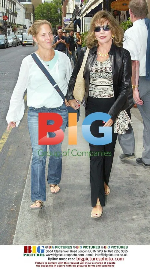Joan Collins Leaving Restaurant
