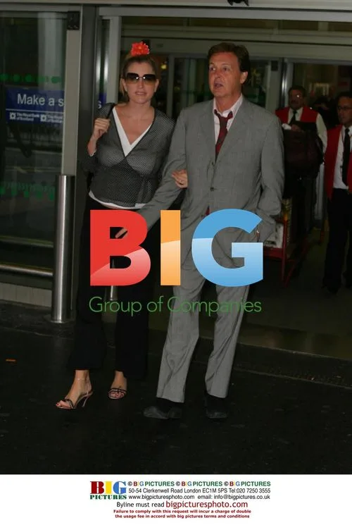 Paul McCartney and Heather McCartney at Heathrow