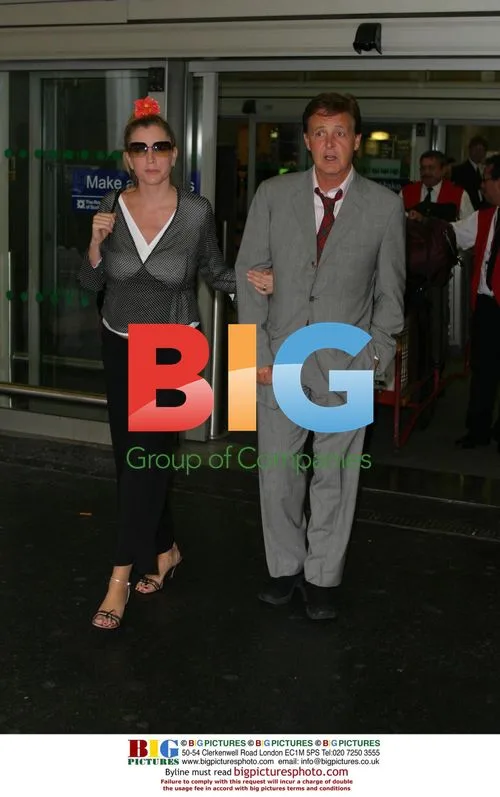 Paul and Heather McCartney at Heathrow