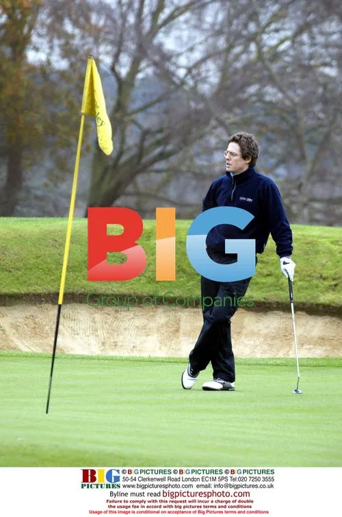 Hugh Grant plays golf
