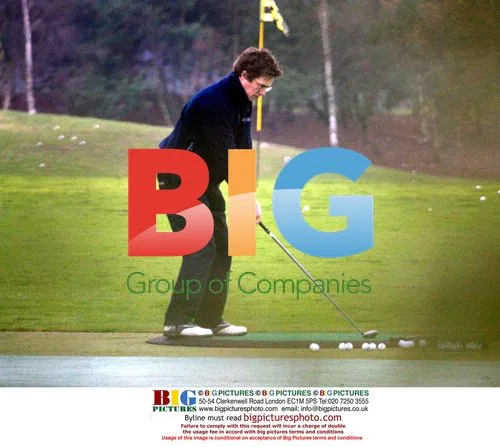 Hugh Grant Playing Golf