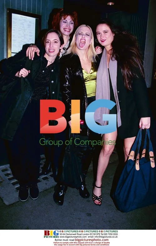 4 Celebrities in Black and Green Posing