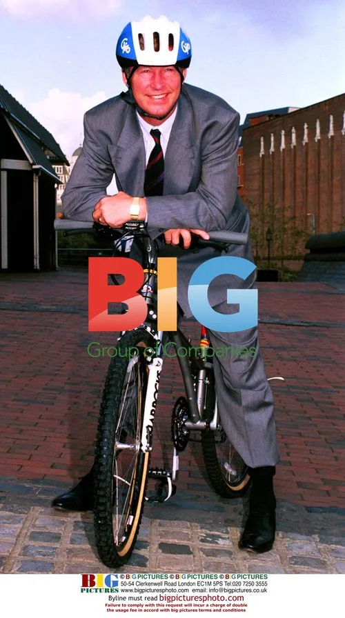 Alex Ferguson on a mountain bike