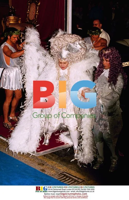 Singer Elton John arrives at his party