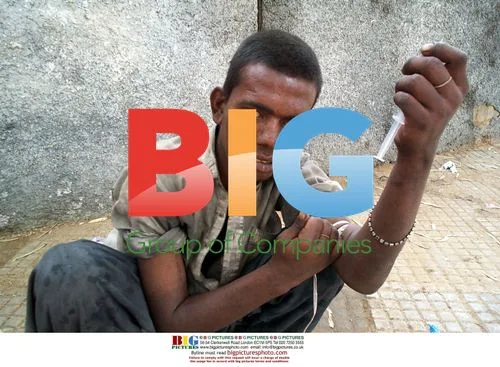 Drug addict preparing to inject heroin in Karachi
