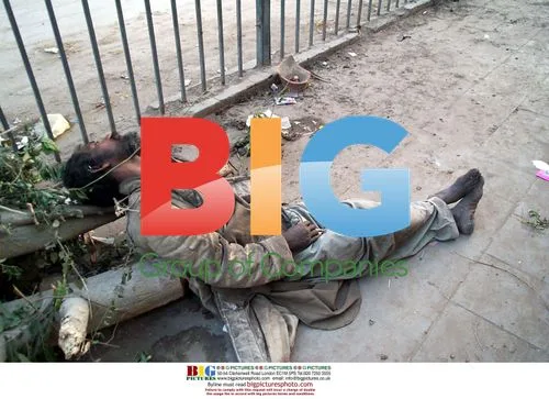 Drug addict unconscious on sidewalk