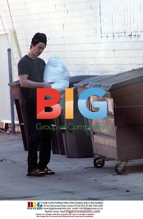 Keanu Reeves takes box to home
