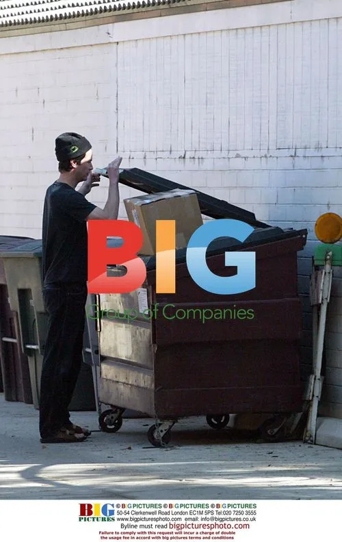 Keanu Reeves Takes Out the Trash