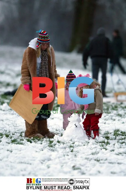 Meg Matthews and Daughter Play in Snow