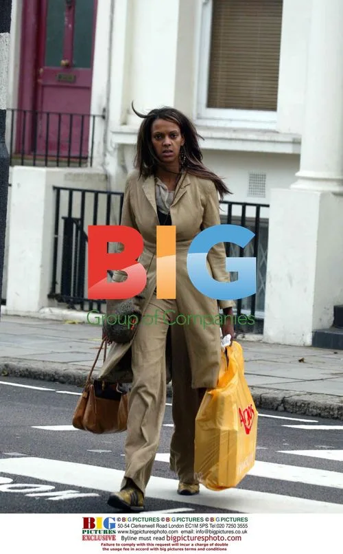 EX EASTENDERS ACTRESS JUDI SHEKONI OUT SHOPPING