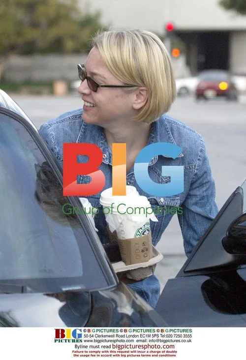 Rene Zellwegger picks up coffee before dress fitting