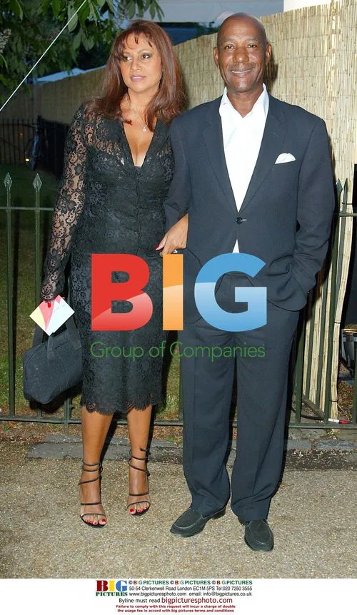 SINGER ERROL BROWN AND PARTNER AT SUMMER PARTY