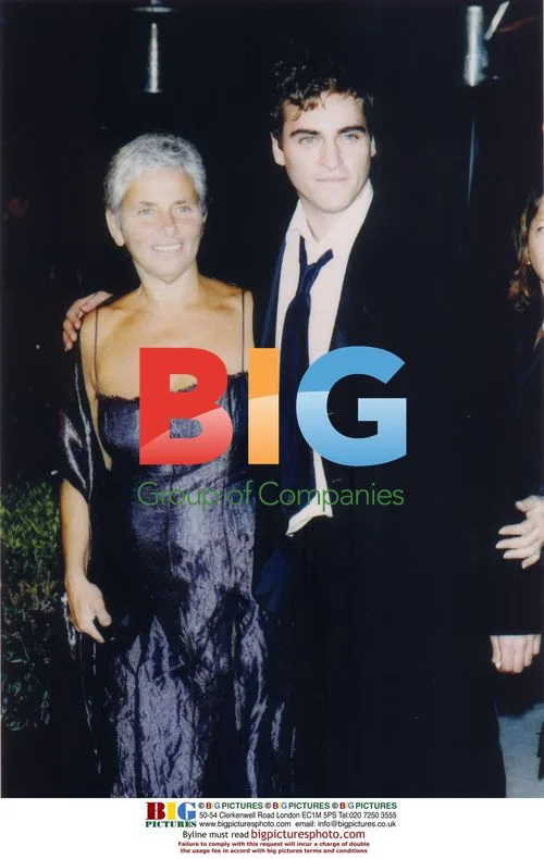 JOAQUIN PHOENIX AND MOTHER AT VANITY FAIR OSCAR PARTY
