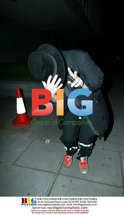 Boy George Hiding Face