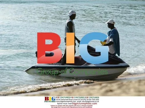 Footballer Dwight Yorke on Jet Ski with son