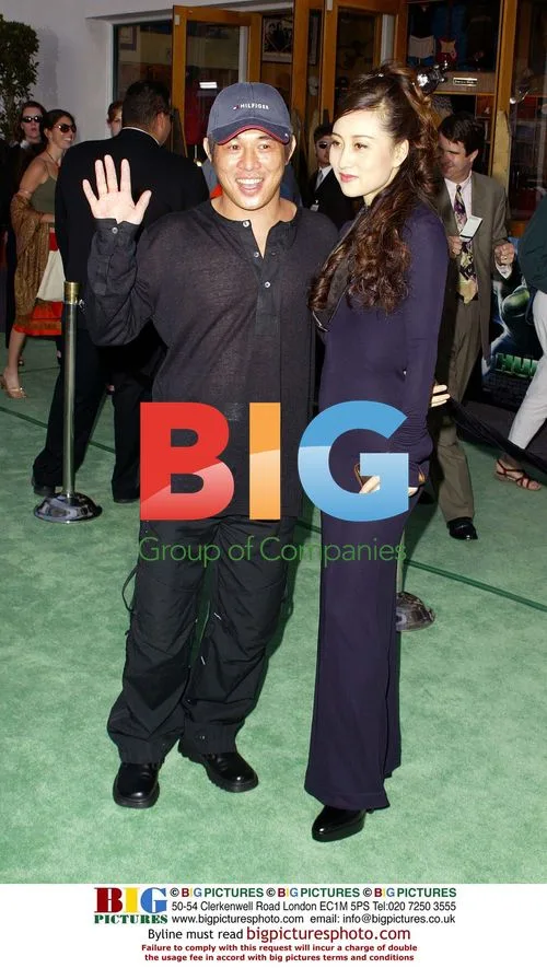 Two celebrities pose at event