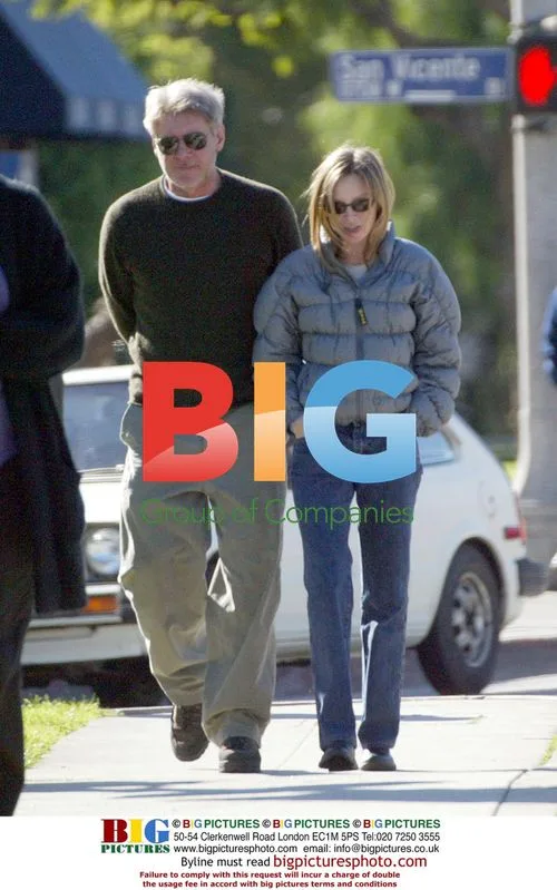 Calista Flockhart and Harrison Ford take a walk