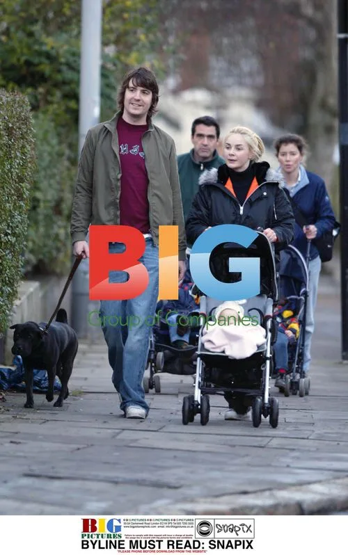Gail and Dan Hipgrave walking with baby Honey