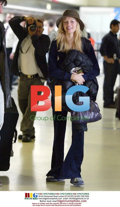 Heather Graham and Chris Weitz at LAX