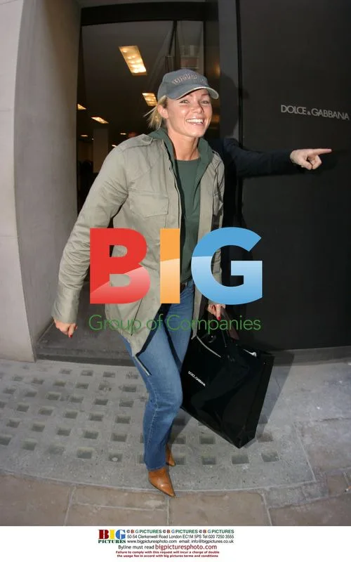 Nell McAndrew leaves Dolce & Gabbana store