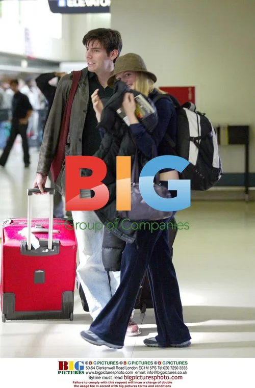 Heather Graham and Chris Weitz at LAX