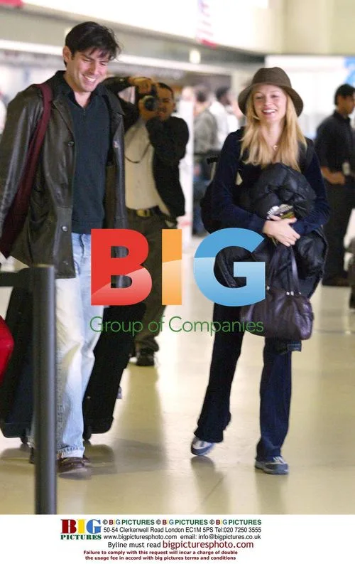 Heather Graham and Chris Weitz at LAX
