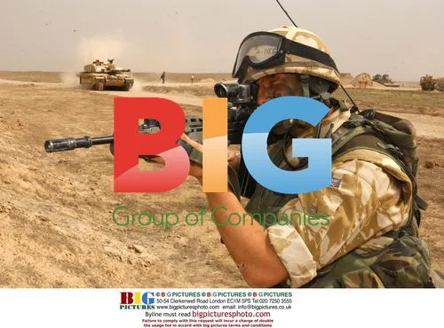 Sergeant Looks Out as Tanks Breach Obstacle