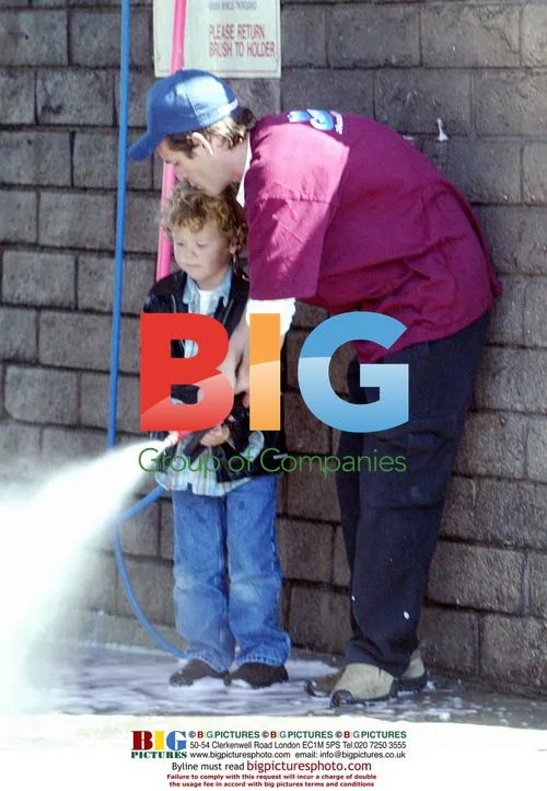 Luke Perry and son wash car in Westwood