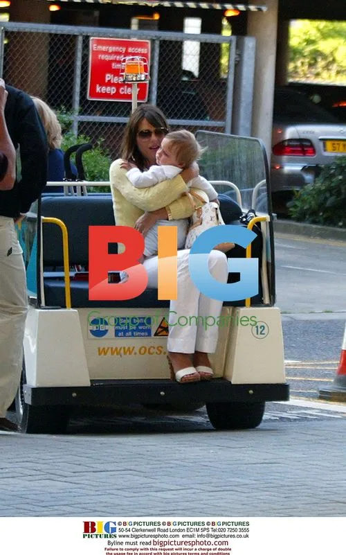 Liz Hurley, son Damien and Arun Nayar arrive in England