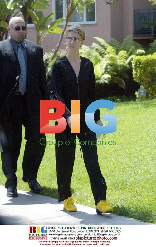 Celine Dion Leaves Hotel in Bold Yellow Shoes