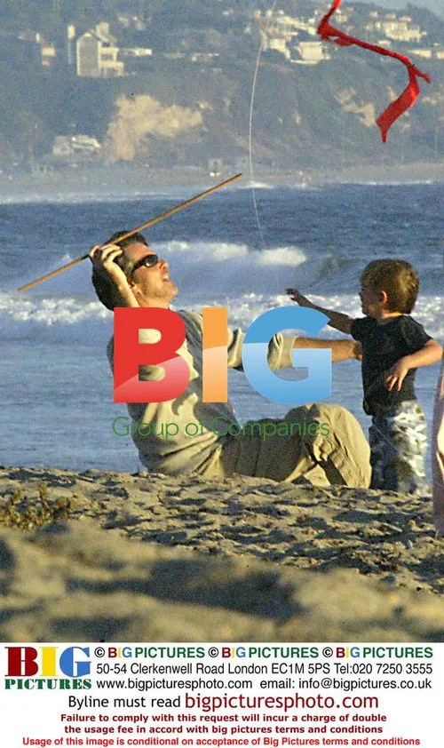 Pierce Brosman plays with family on beach