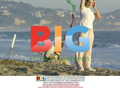 Pierce Brosman with Family on Beach