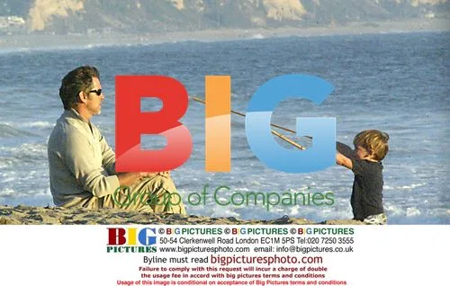 Pierce Brosman with family on beach