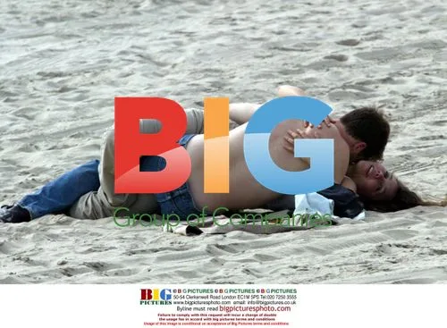 Maggie Gyllenhall and Peter Sarsgaard Beach Kiss